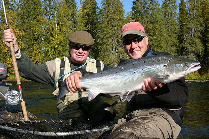 Atlantic Salmon fishing holiday in Umba River and Krivetz based on full board accommodation, personal guide service with boat, duration as you wish. Hook the biggest or catch a lot!